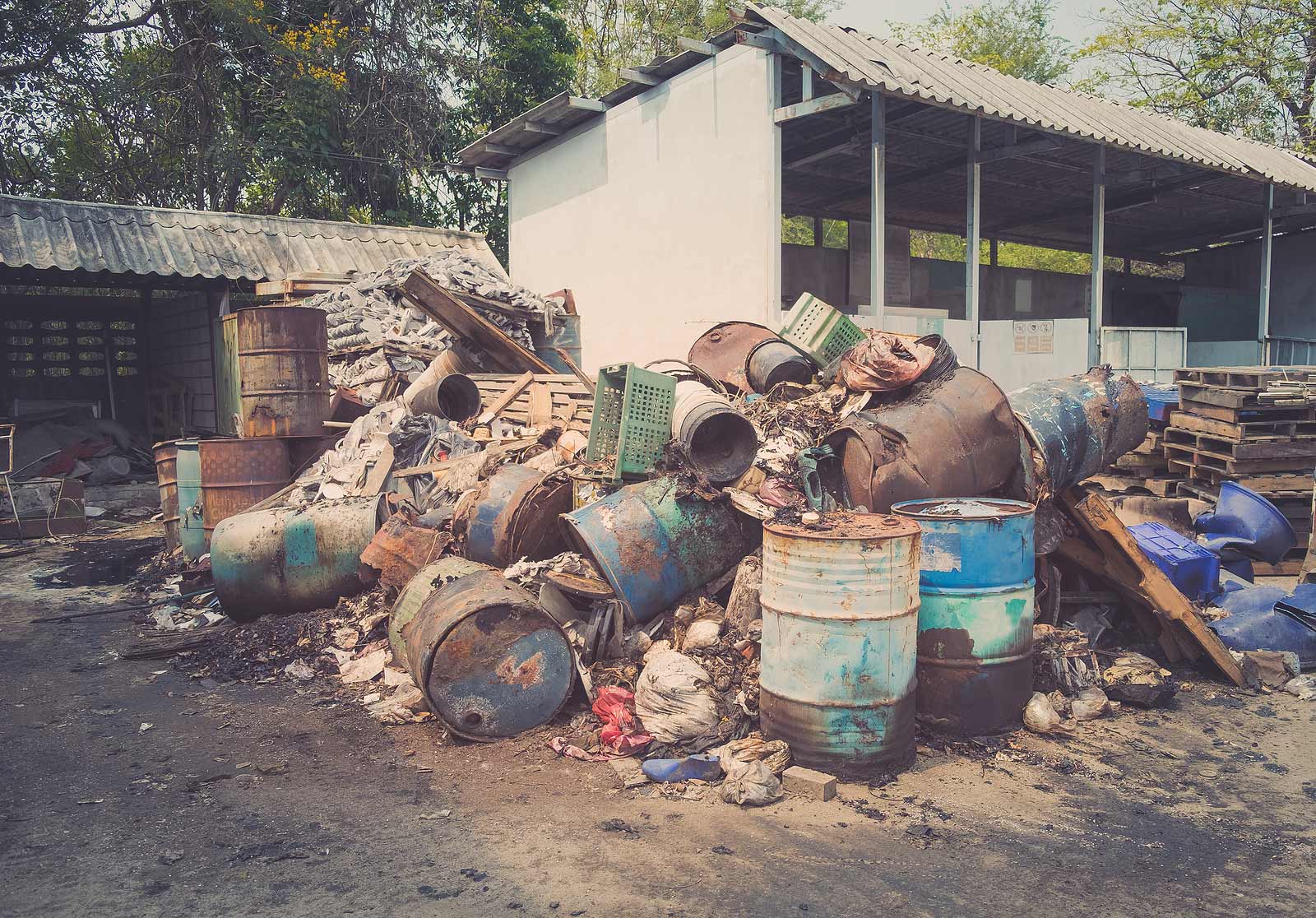 empty barrels piled, mid remediation process